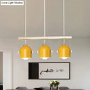 Modern green dome island light with wood accents for kitchen dining