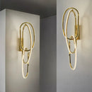 Modern interlocking oval gold wall sconce lighting fixture bedroom