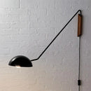 Modern matte black swing arm bedside wall lamp with wood accent bedroom