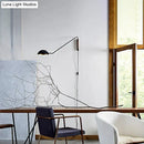 Modern matte black swing arm bedside wall lamp with wood accent bedroom