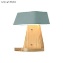Modern metal trapezoid wall sconce with wooden backplate living room