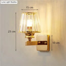 Modern minimalist gold wall lamp with crystal shade for bedroom