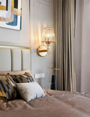 Modern minimalist gold wall lamp with crystal shade for bedroom