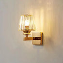 Modern minimalist gold wall lamp with crystal shade for bedroom