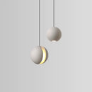 Modern minimalist gray and gold pendant light dining room