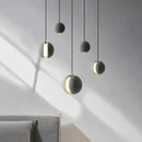 Modern minimalist gray and gold pendant light dining room