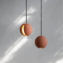 Modern minimalist gray and gold pendant light dining room