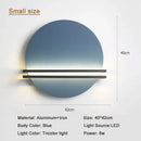 Modern orange and black circular wall lamp for bedroom