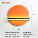 Modern orange and black circular wall lamp for bedroom