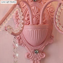Modern pink metallic scroll arm wall lamp with crystal bedroom sconce