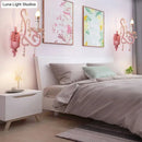 Modern pink metallic scroll arm wall lamp with crystal bedroom sconce