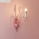 Modern pink metallic scroll arm wall lamp with crystal bedroom sconce