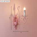 Modern pink metallic scroll arm wall lamp with crystal bedroom sconce