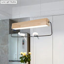 Modern rectangular wood and metal pendant light with birds dining room