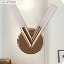 Modern rose gold v-shaped bedroom sconce with white glass shade