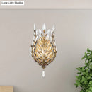 Modern silver & brass laurel wall light with crystal drop bedroom