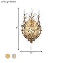 Modern silver & brass laurel wall light with crystal drop bedroom
