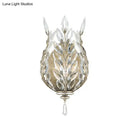 Modern silver & brass laurel wall light with crystal drop bedroom