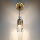 Modern single light brass wall sconce with clear crystal for bedroom