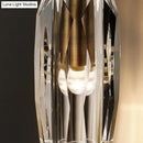 Modern single light brass wall sconce with clear crystal for bedroom