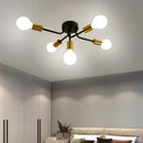 Modern symmetrical brass ceiling light with five spheres for living room