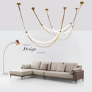 Modern tan leather and brass led tube suspension chandelier living room