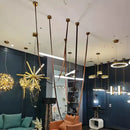 Modern tan leather and brass led tube suspension chandelier living room