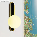 DecorBites™ Modern Clear/Cream Glass Orb Wall Light with Brass Mount