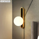 DecorBites™ Modern Clear/Cream Glass Orb Wall Light with Brass Mount