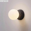 Modern volcanic stone and white glass wall lamp living room