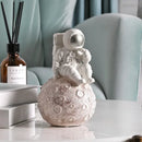 Modern white and gold astronaut phone holder living room figurine