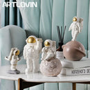 Modern white and gold astronaut phone holder living room figurine
