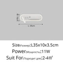 Modern white bedside wall lamp with wireless charging for bedroom
