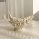 Modern white ceramic tissue box with camellia flower for living room