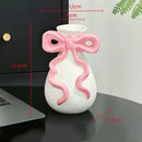 Modern white ceramic vase with pink cute bow living room decor