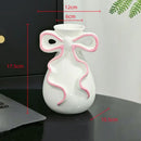 Modern white ceramic vase with pink cute bow living room decor