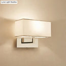 Modern white fabric wall sconce with polished brass for bedroom