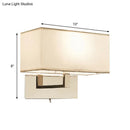 Modern white fabric wall sconce with polished brass for bedroom