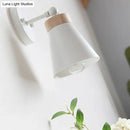 Modern white finish bedside sconce with wood accent bedroom wall lamp