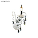 Modern white wall sconce light with teardrop crystal decoration living room