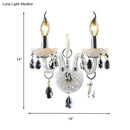 Modern white wall sconce light with teardrop crystal decoration living room