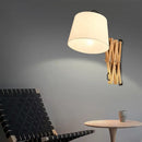 Modern wood accordion sconce with white fabric shade bedroom light