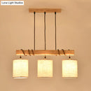 Modern wood and beige fabric island lighting fixture dining room