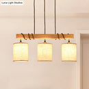 Modern wood and beige fabric island lighting fixture dining room