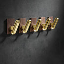 Modern wood and brushed gold wall hook row for kitchen