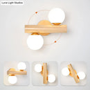 Modern wood and white glass ball rotating wall sconce bedroom light