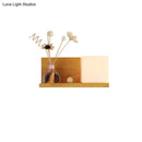 Modern wood floating shelf with beige wall lamp – bedroom sconce light
