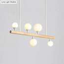 Modern wood island lamp with five globe lights dining room