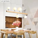 Modern wood island lamp with five globe lights dining room