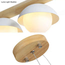 Modern wood stem linear chandelier with white shade dining room light